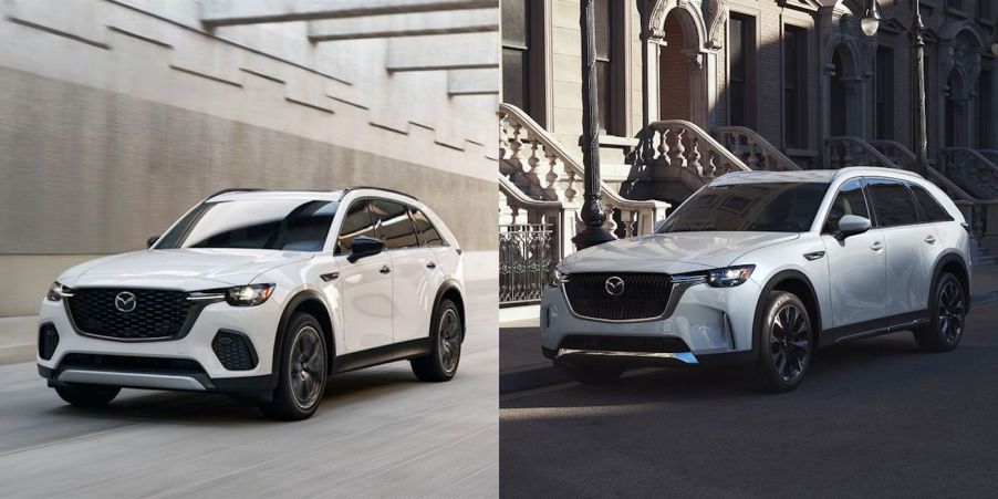 White and silver Mazda crossover SUVs next to each other.