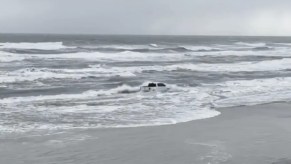 A Ram 1500 being driven into the water