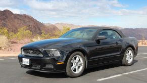 A convertible S197 Ford Mustang, like the generation from the "Fast & Furious" franchise.