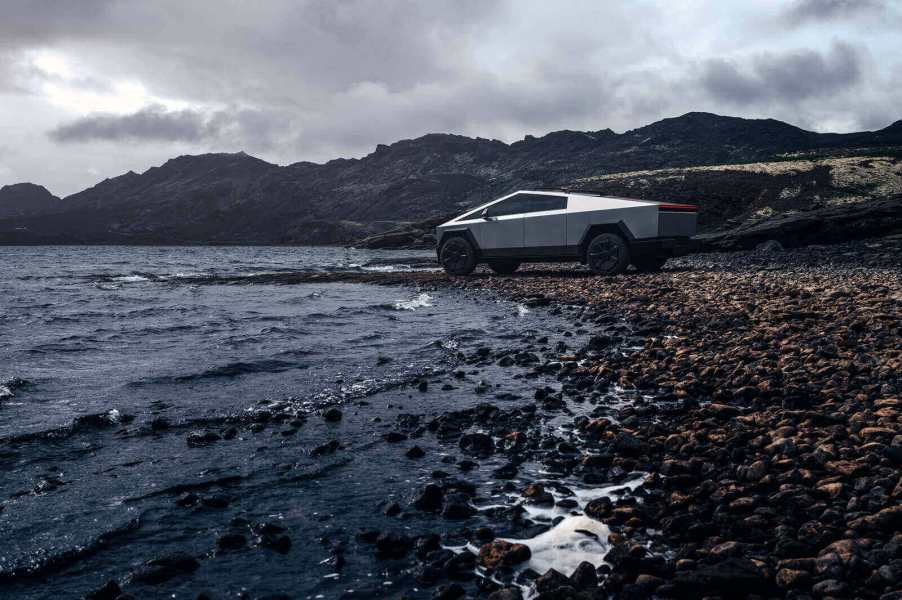 A Tesla Cybertruck defies rust concerns by parking next to the water.