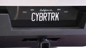 The "Bybrtrk" vanity plate on a Tesla Cybertruck parked in a museum