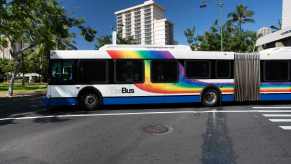 Two-section bus drives through the airport in Honolulu Hawaii