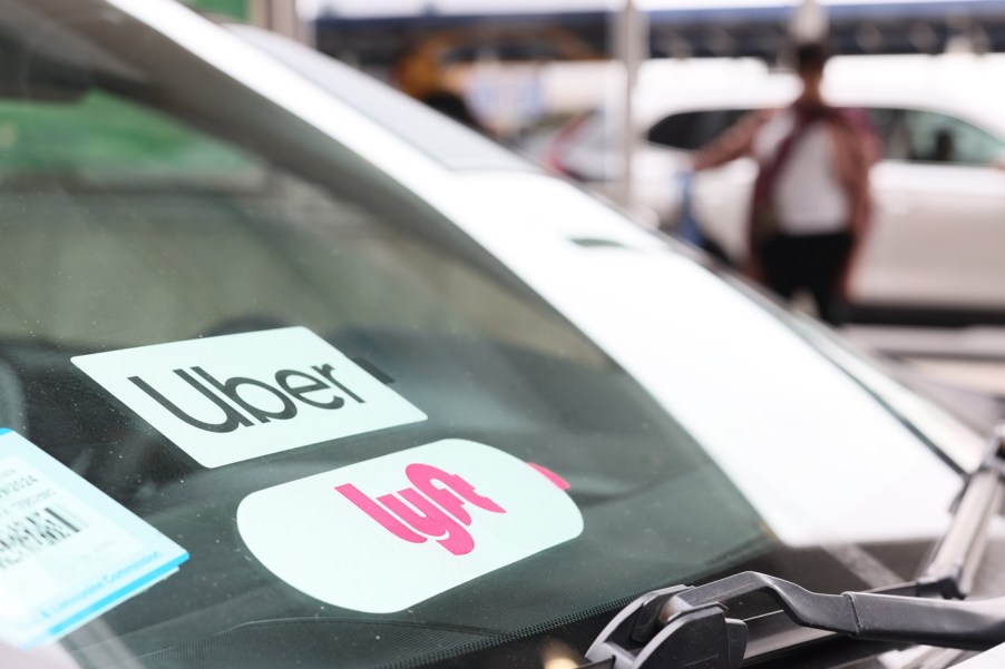 Uber and Lyft stickers on a windshield