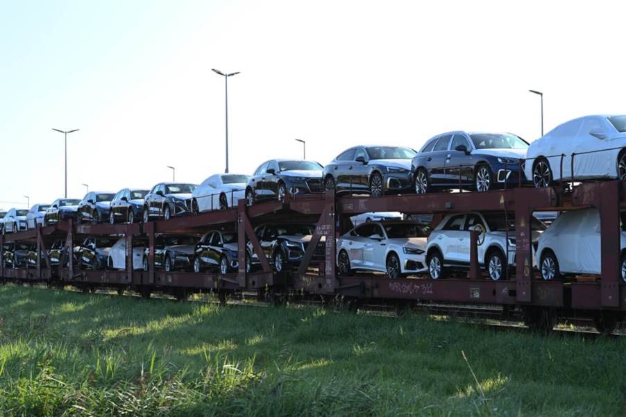 Volkswagen cars, along with Audis are stacked on a train after clearing conditions that could've got them impounded.