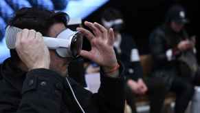 A man tries on an Apple Vision Pro in an Apple store