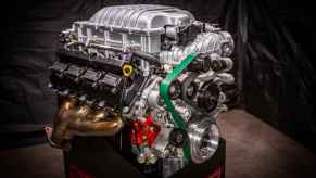 Mopar's Hellephant V8 Hemi crate engine on display with shadowy lighting