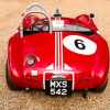 Rear of a red vintage roadster race car.