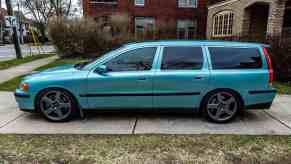 Unique green stick shift Volvo V70 R turbocharged wagon in a driveway