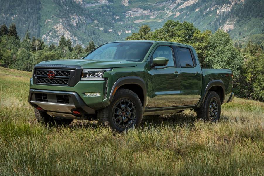 The 2023 Nissan Frontier off-roading in a field