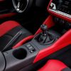 A 2023 Nissan Z sports car shows off its manual transmission shift knob.