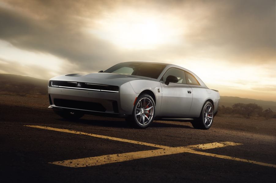 A 2024 Dodge Charger Daytona Scat Pack sits under an overcast sky.