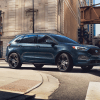 The 2024 Ford Edge driving in the city