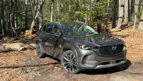 The 2024 Mazda CX-50 off-roading in the woods