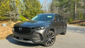 The 2024 Mazda CX-50 parked near trees