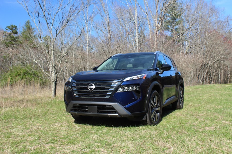 The 2024 Nissan Rogue off-roading in a field