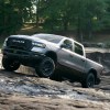 The 2025 Ram 1500 Rebel climbing over rocks