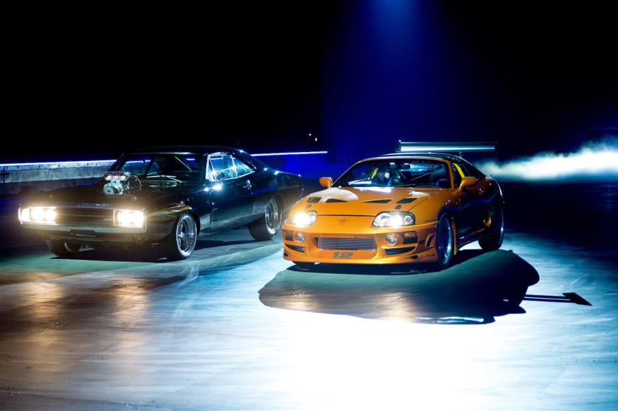 Dodge Charger and Toyota Supra staging a Fast and Furious drag race