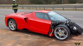 A crashed, red Ferrari Enzo