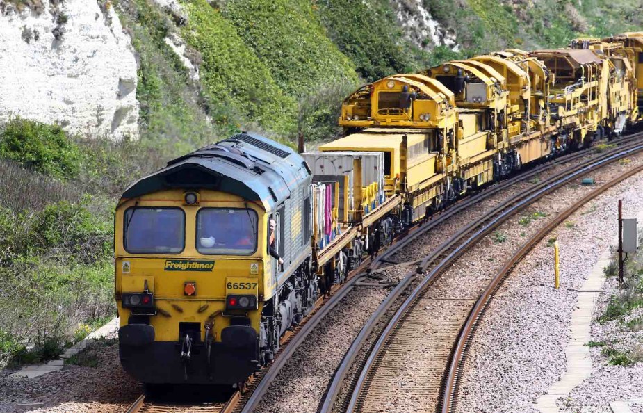 Yellow locomotive pulling a freight train in Englaind