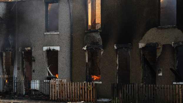 Trash Truck Driver Climbs a Burning Building to Rescue Two People and a Dog