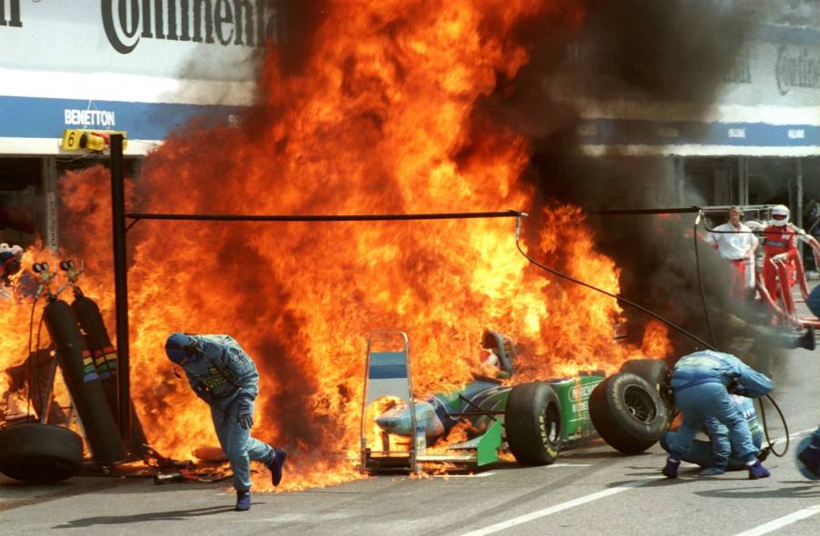 Giant fuel fire in Formula 1 pit lane.