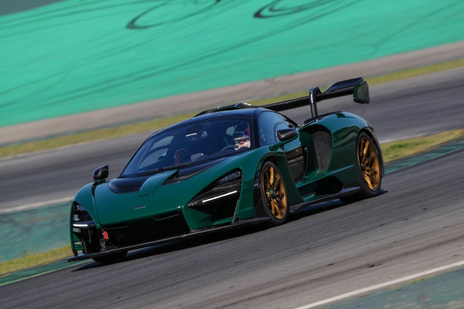 Green McLaren Senna racing around a track.