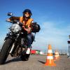 A student rides on a course before earning a motorcycle license.