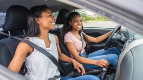 Teenage driver getting lessons from her mother