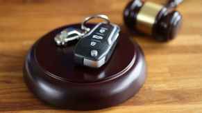 gavel in close view with car key chain