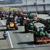 Famers drive tractors down the A63 highway in southwestern France blue, green, yellow tractors take up the road