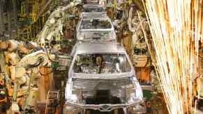 Ford assembling the Mustang muscle cars in a factory.