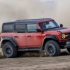 The 2024 Ford Bronco Raptor kicking up dirt