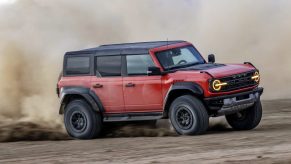 The 2024 Ford Bronco Raptor kicking up dirt