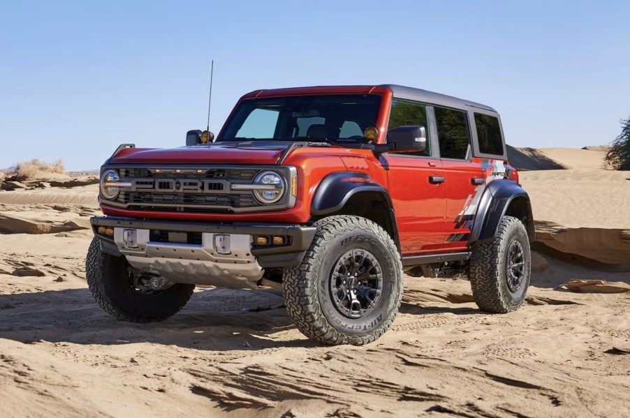 The Ford Bronco Raptor sitting in sand