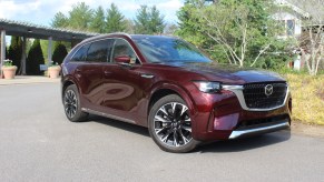 The 2024 Mazda CX-90 parked near foliage