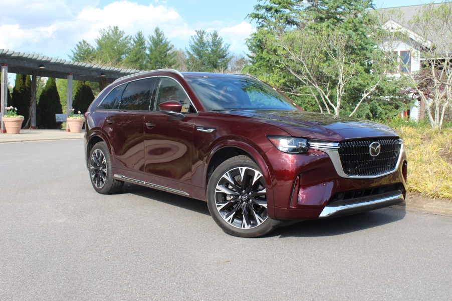 The 2024 Mazda CX-90 parked near foliage