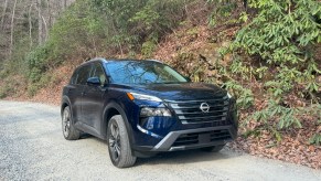 The 2024 Nissan Rogue on a gravel road