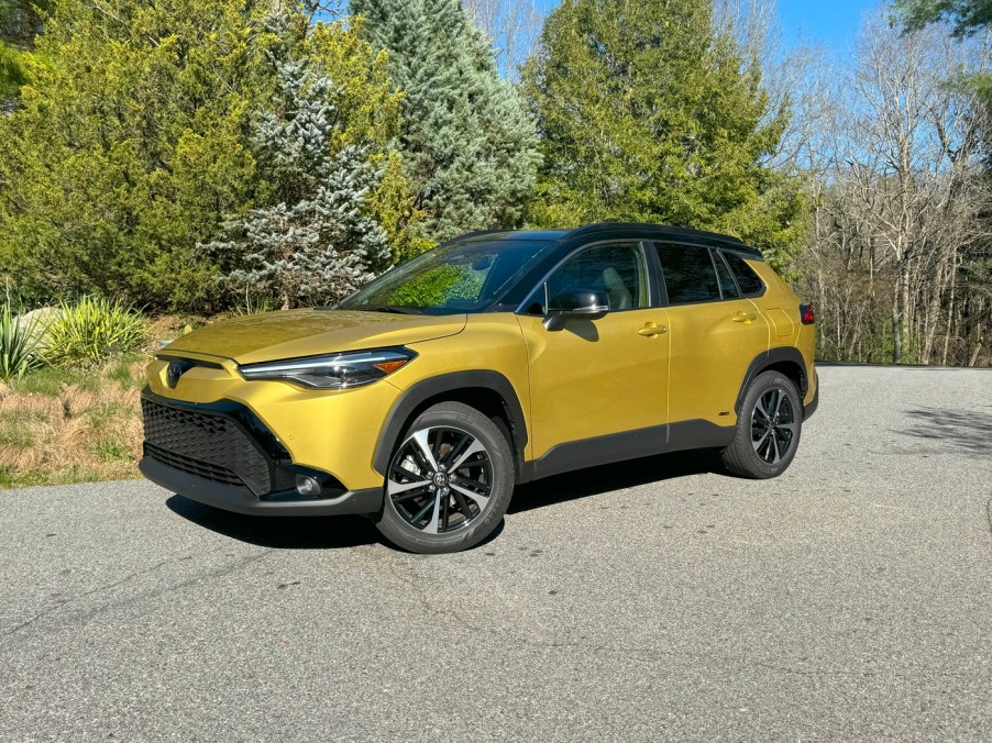 The 2024 Toyota Corolla Cross Hybrid near trees