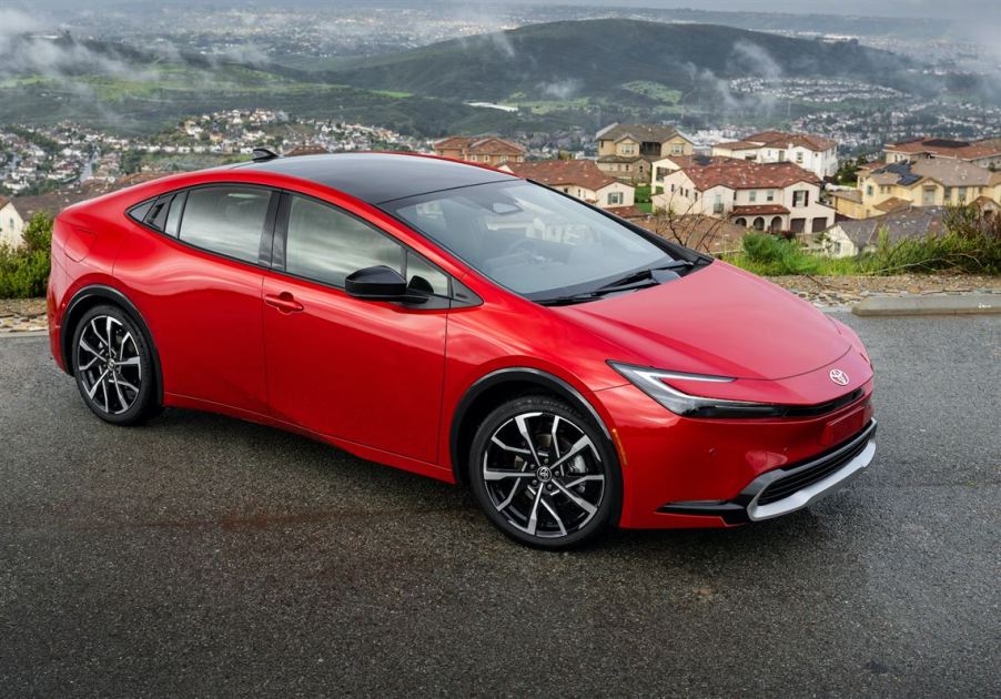 The 2024 Toyota Prius Prime parked in front of a city view