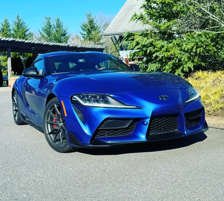 The 2024 Toyota Supra parked near foliage