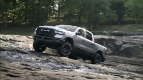 The 2025 Ram 1500 RHO climbing over rocks