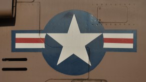 The Air Force's star insignia on the aluminum side of a plane.