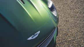 An Aston Martin DB12 'Super Tourer' car shows off its badge.