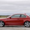 An E82 BMW 1 Series, like the 128i or 135i, shows off its side profile.