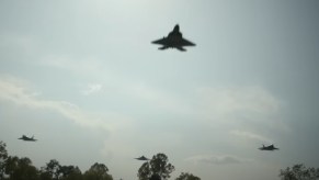 A flight of F-22 Raptor military airplanes in 'Civil War'.