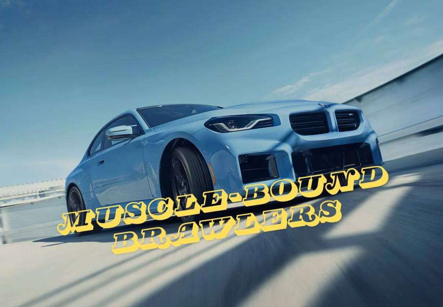 A blue 2024 BMW M2 slides sideways on a closed circuit.