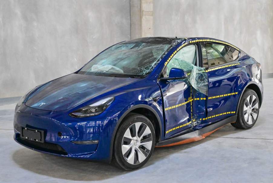 Blue Tesla Model 3 Smashed up after a crash test.