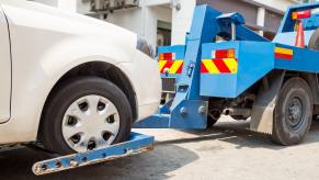 Tow truck pulling a sedan