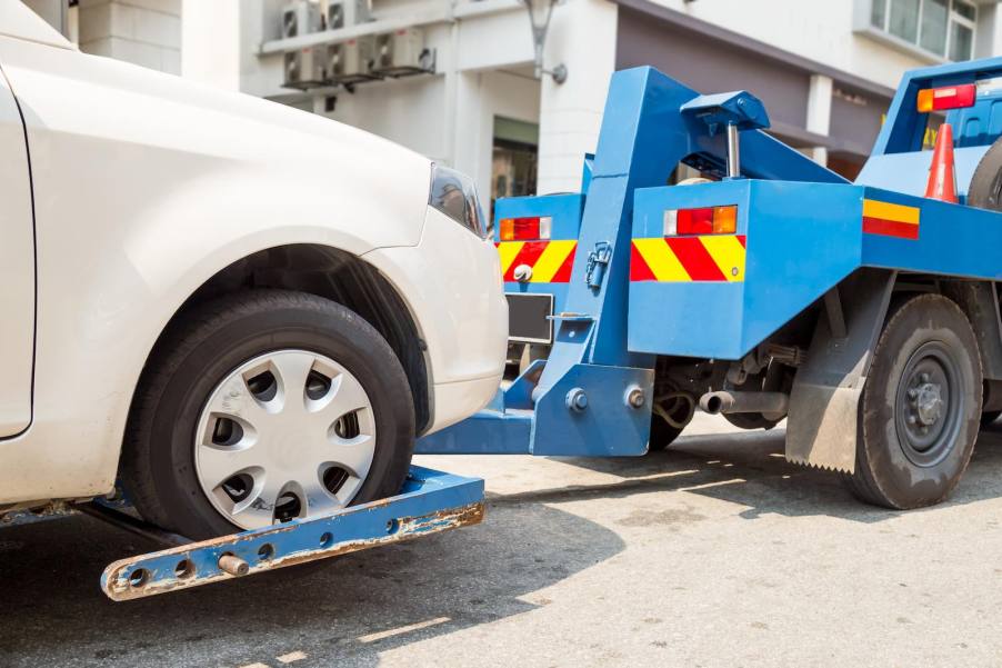 Tow truck pulling a sedan