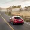 An Alfa Romeo Giulia Quadrifoglio drives across the desert.